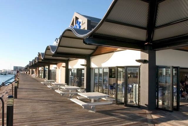 Dolphin Quay, Mandurah Ocean Marina, 72km south of Perth uses roofing made from COLORBOND® steel in profile LYSAGHT CUSTOM BLUE ORB® and in colour Woodland Grey®.